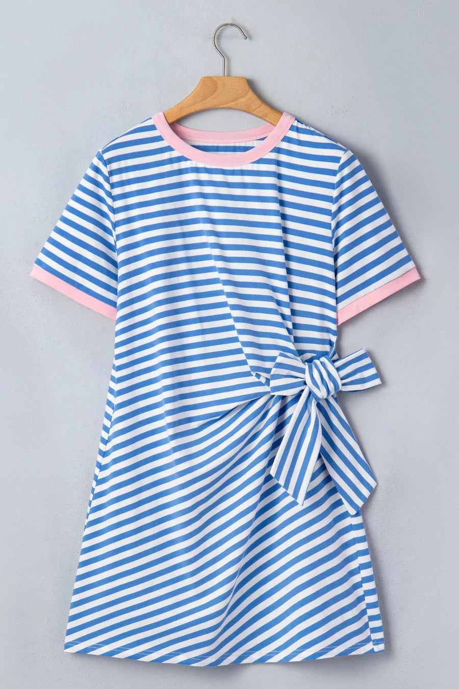 Blue and white striped cotton mini dress with pink trim and a tie detail.