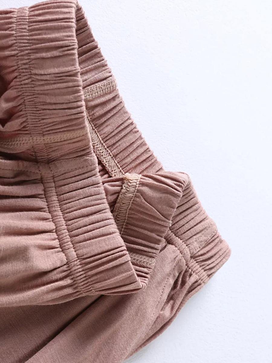 Pajama pants in Milk Tea Camel with ruched elastic waistband and pocket detail.