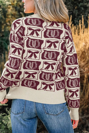 burgundy pullover sweater featuring ribbed cuffs and bow and horseshoe motif