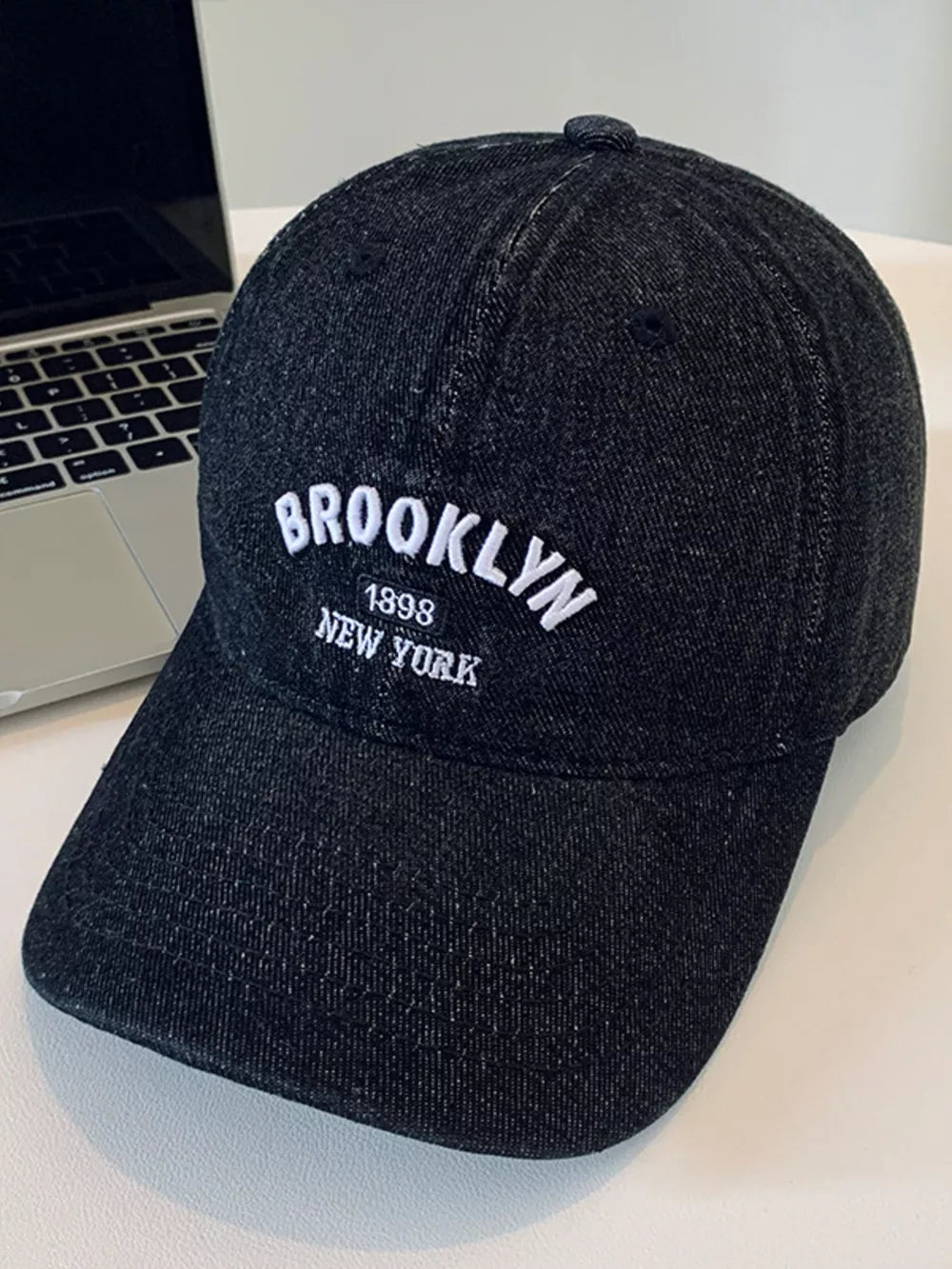 Black baseball cap with embroidered Brooklyn New York text