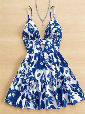Vibrant floral v-neck mini dress with cutout and tiered skirt.