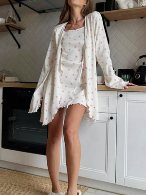 pink wrap dress featuring ruffled hem and ditsy floral