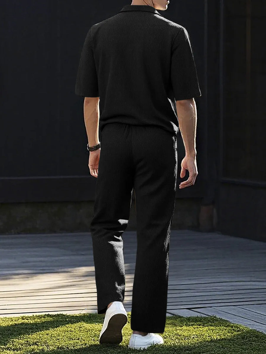 Black textured short sleeve polo shirt and matching drawstring pants set.