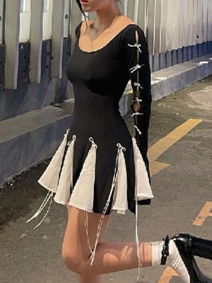 Black mini dress with bowknot details on sleeves and skirt hem.