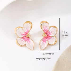 Pink butterfly blossom stud earrings with 18K gold-plated details