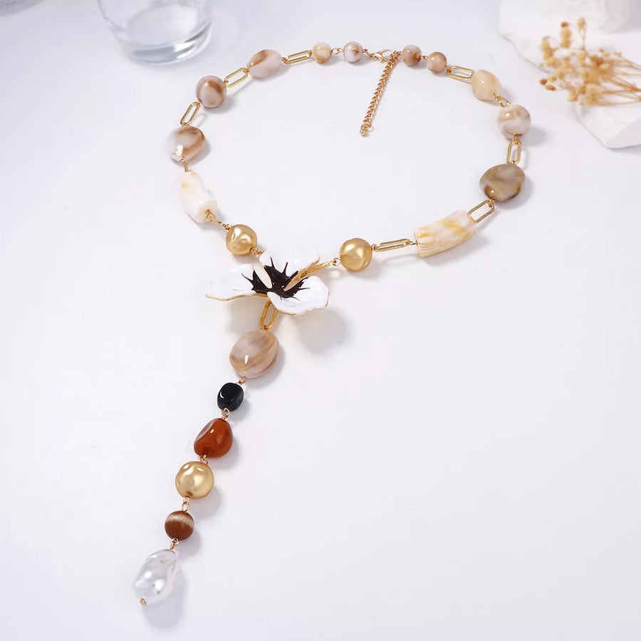 necklace in gold with floral and Y-shaped
