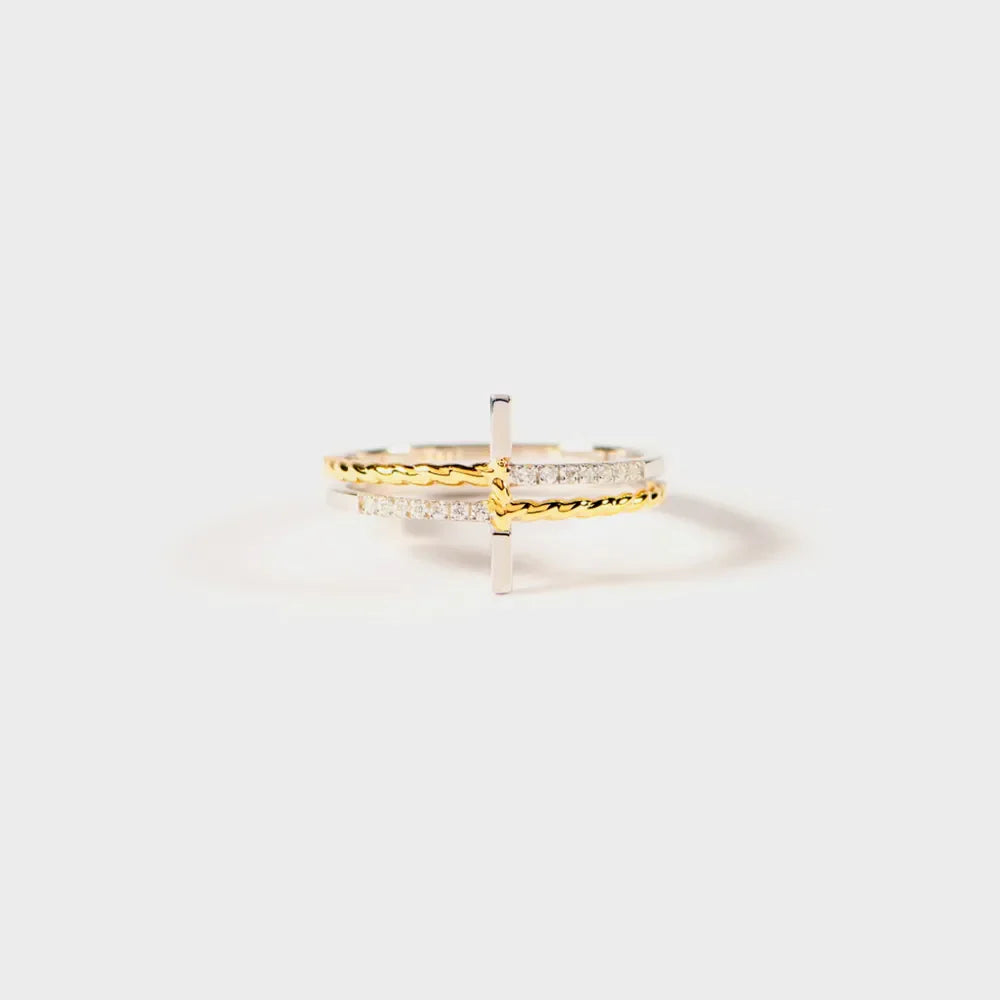 Gold and silver stacked ring with crossbar detail and pave stones