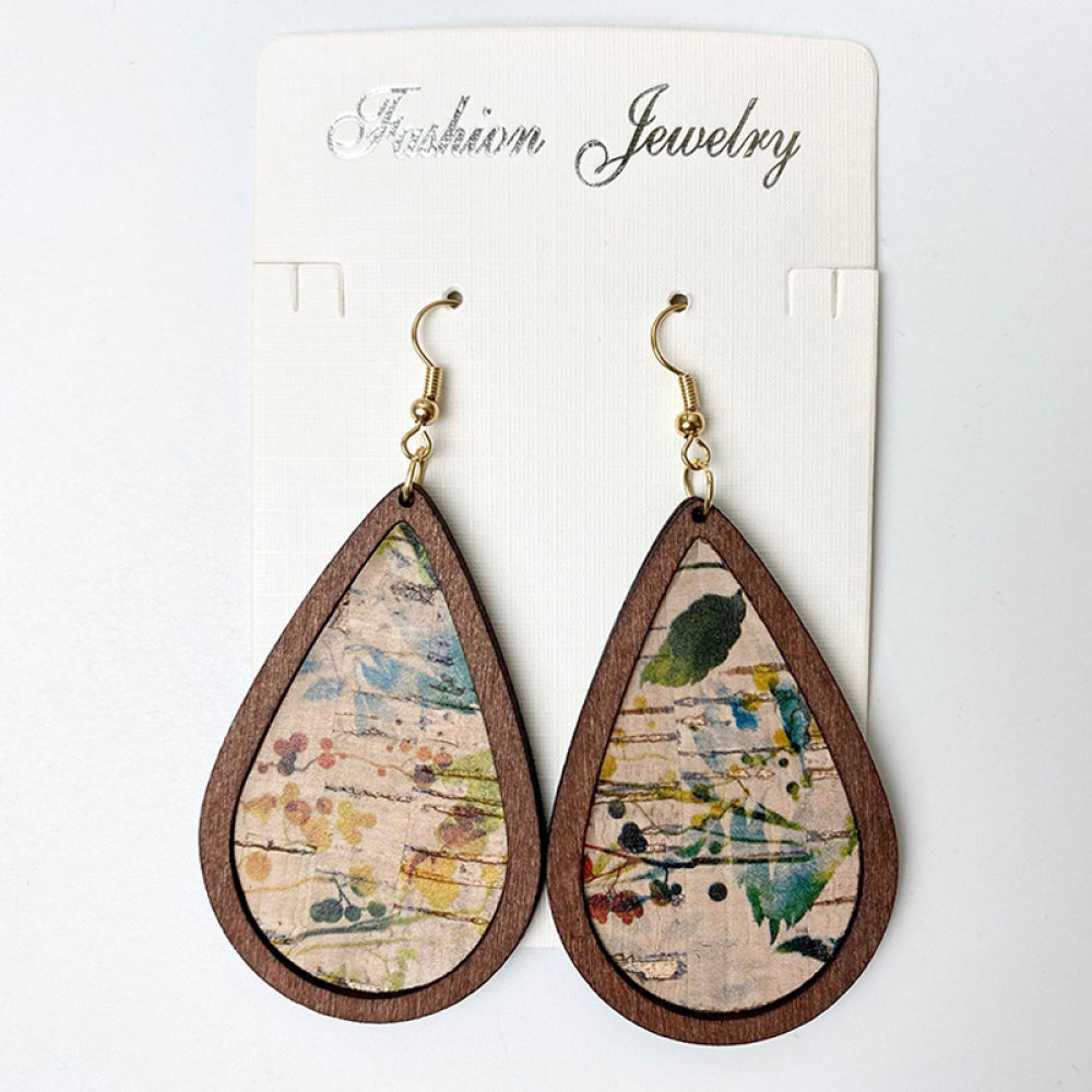 Teardrop cork earrings with botanical print and wooden frame.