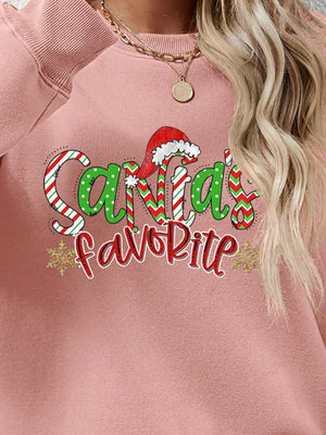 Blush Pink sweatshirt with Santa's Favorite festive graphic and snowflakes.