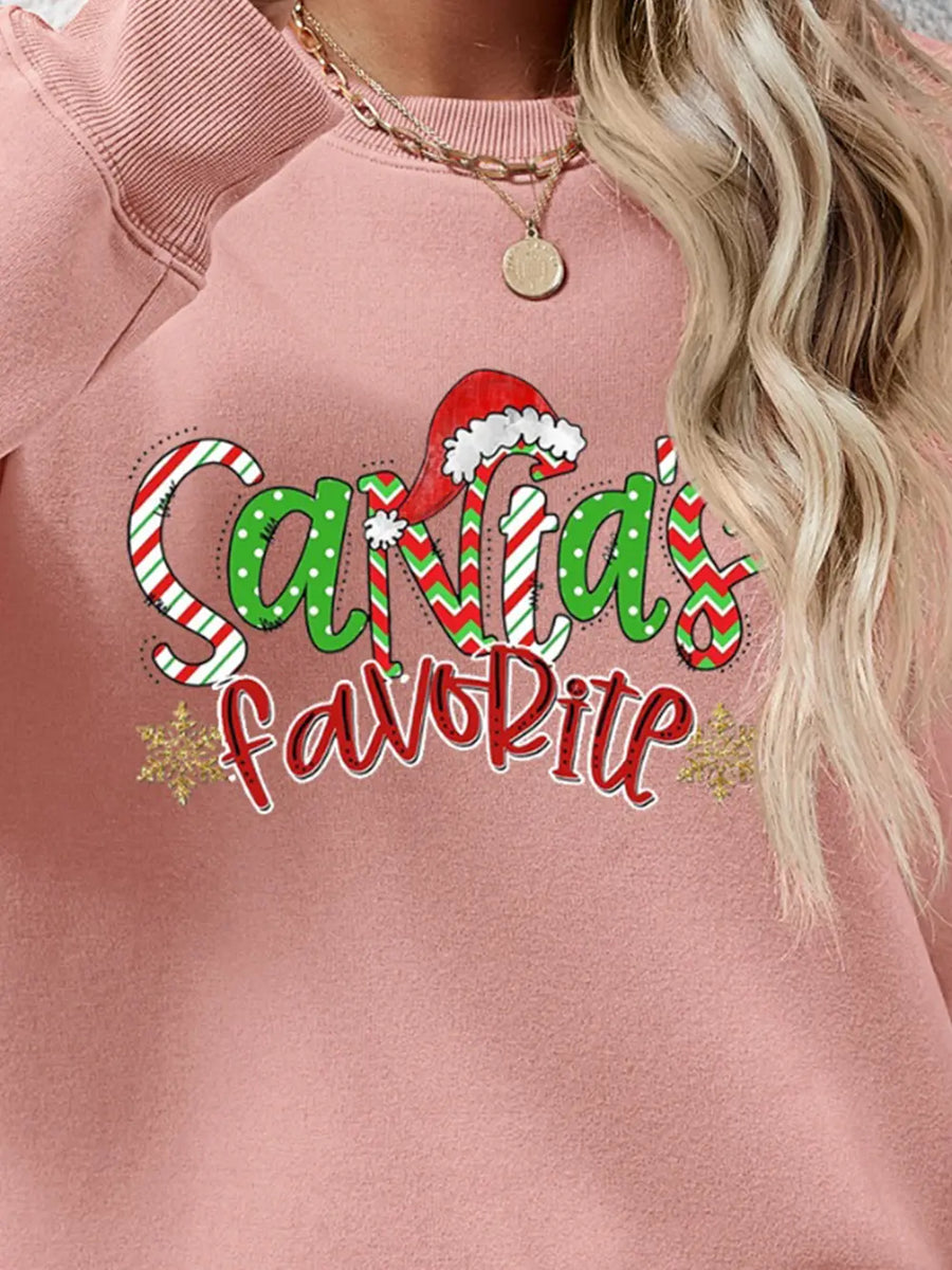 Blush Pink sweatshirt with Santa's Favorite festive graphic and snowflakes.