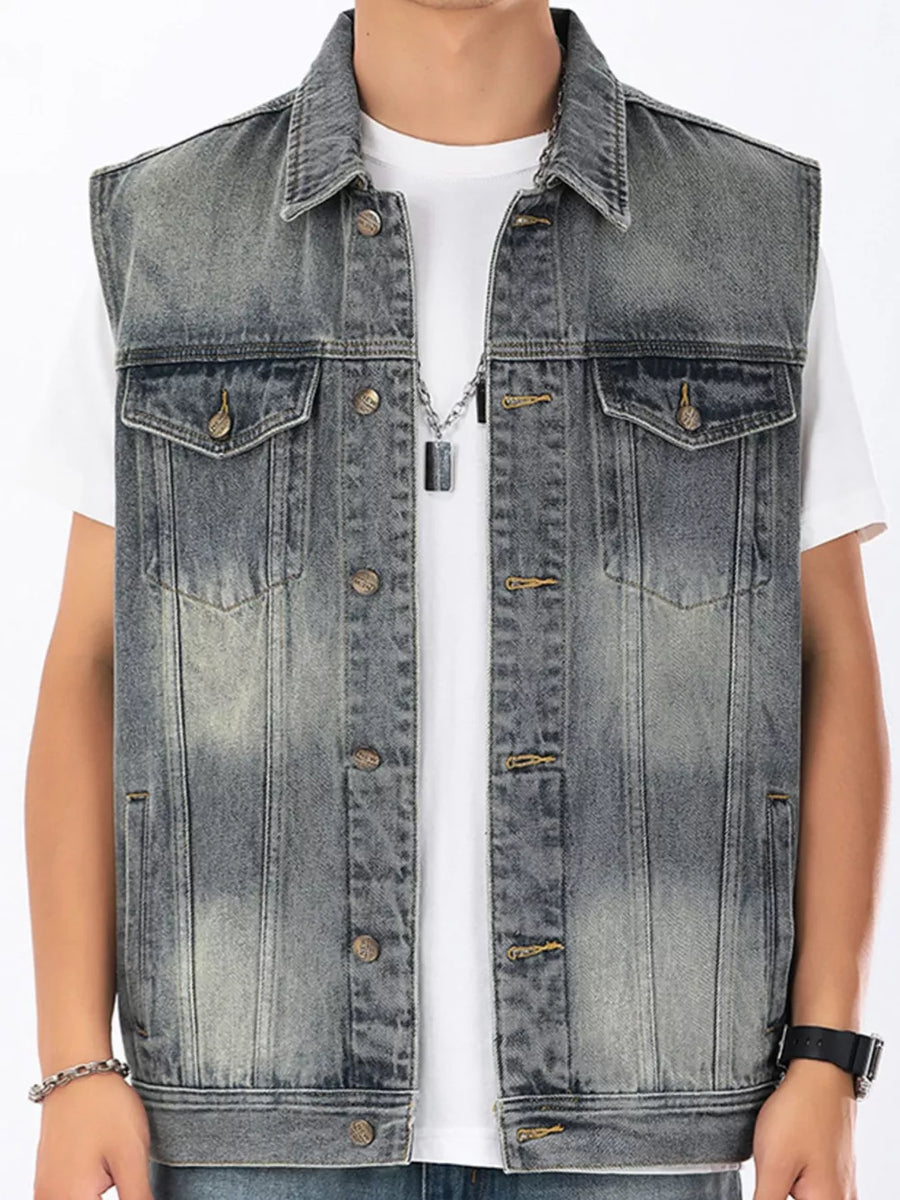 Men's gray denim vest with button front and chest pockets, styled with a white t-shirt.