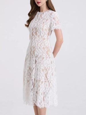 White lace midi dress with short sleeves and pearl embellishments at the neckline.