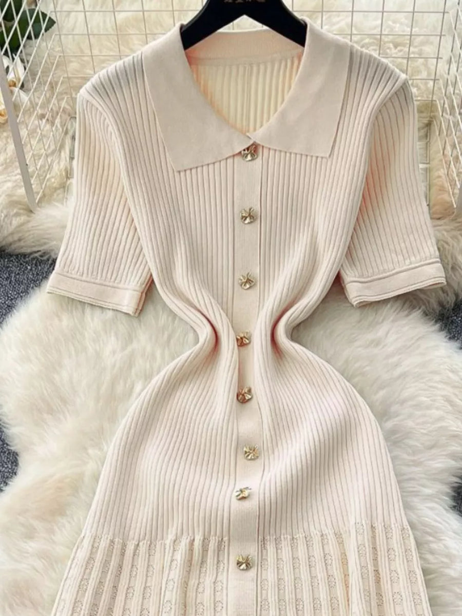 Apricot knit Peter Pan collar dress with button front and short sleeves.