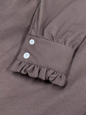 Coffee brown midi dress sleeve cuff with ruffle hem and two white buttons.