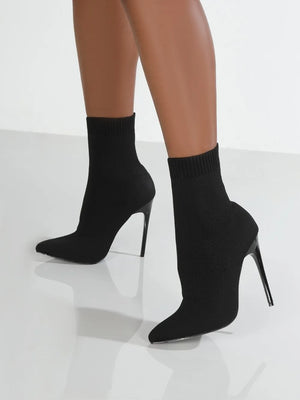 Black knit sock booties with pointed toe and stiletto heel