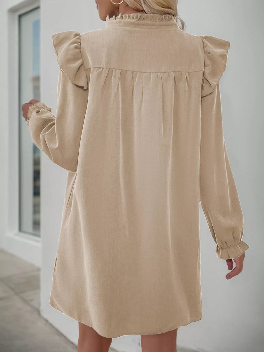 Apricot cotton blend dress with ruffled notched sleeves and hem.