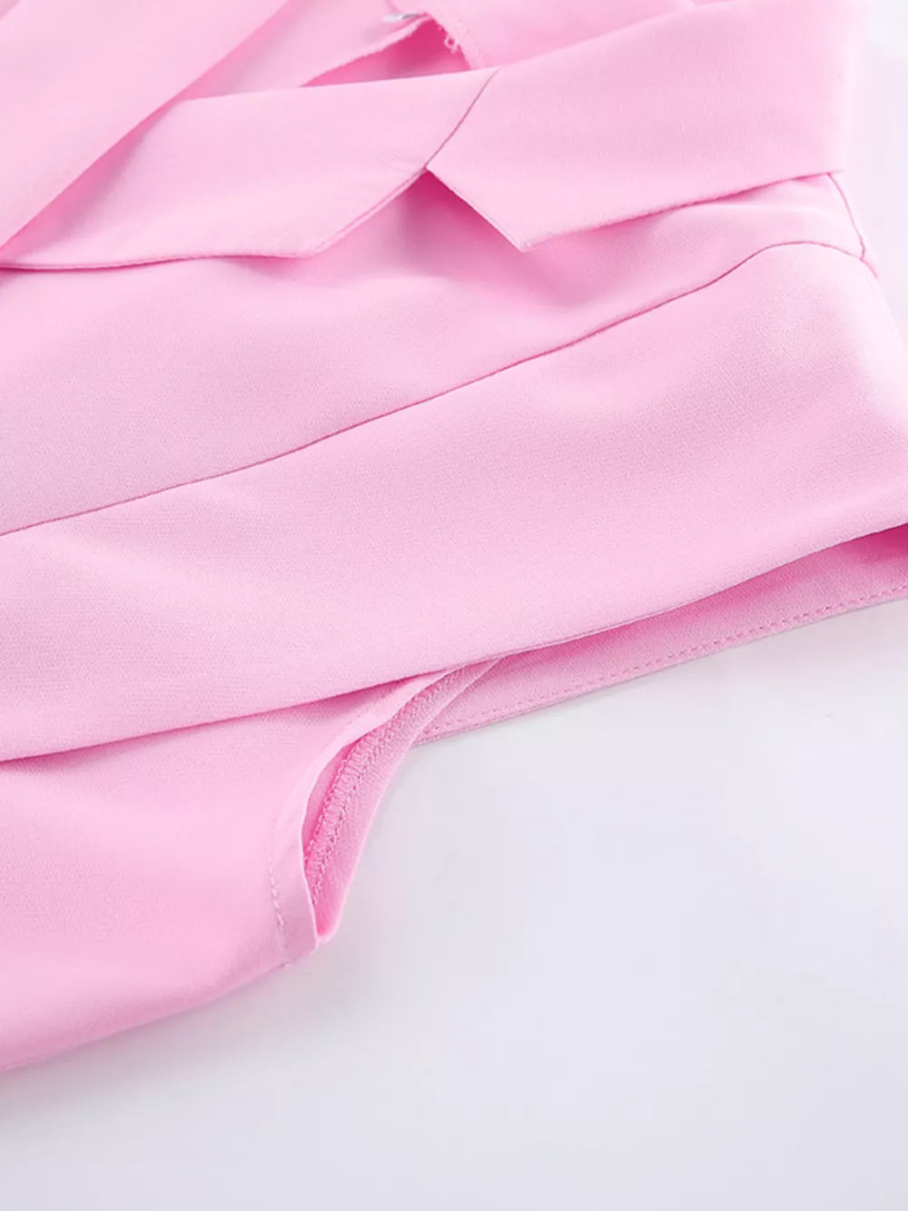 two-piece set in Pink with buttoned and hip-length top, full-length bottom
