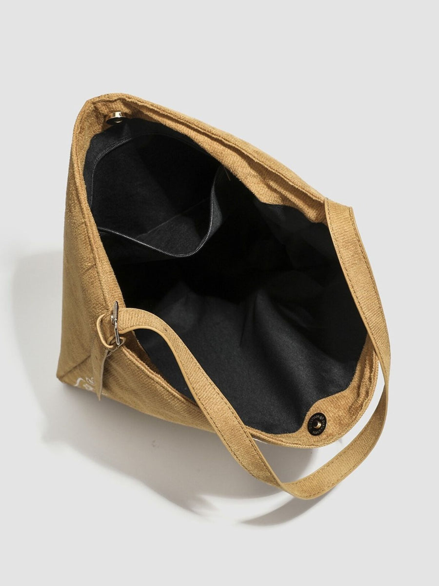 handbag featuring embroidered in camel with Suede Imported Size &amp texture