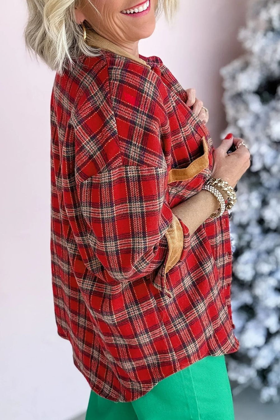black shacket featuring buttoned and plaid