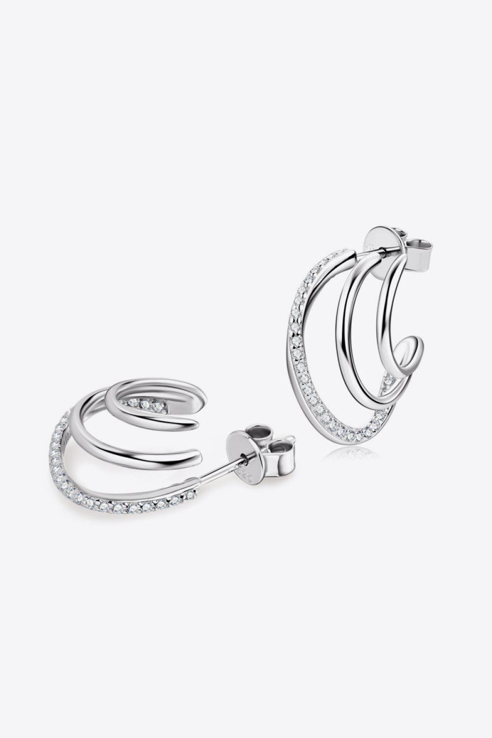 Silver triple hoop diamond stud earrings with pave diamond accents