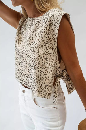 Knot detail leopard print tank top in cream and black, with a crew neck and sleeveless design.