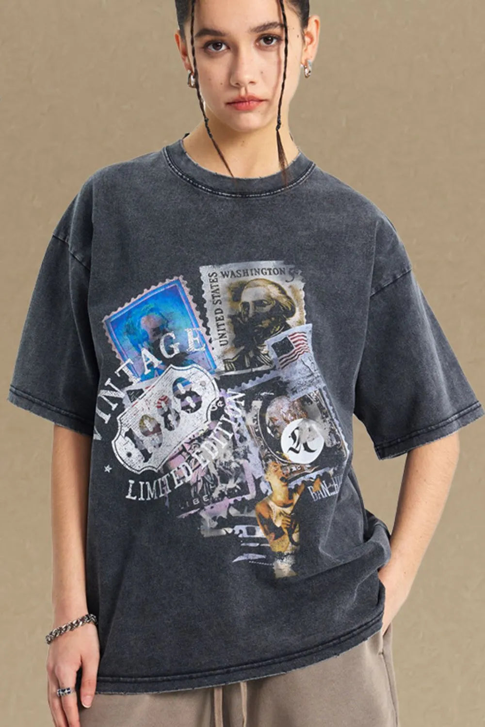 Vintage Stamp Oversized Tee in black with a distressed graphic print and crew neck.