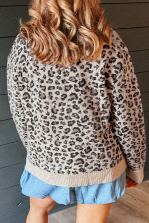 dark brown crewneck sweater featuring stretch and leopard