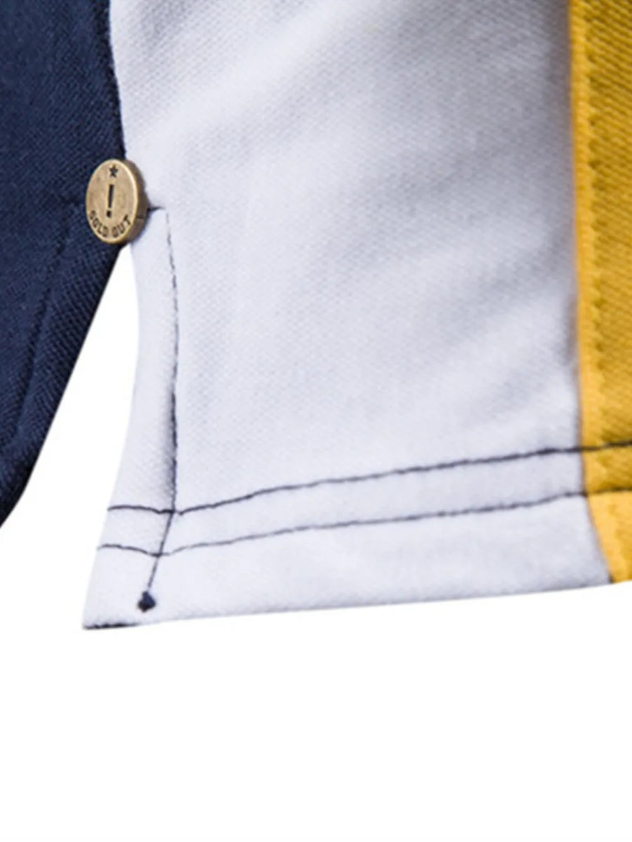 Colorblock polo shirt with navy, white, and yellow panels and a gold button detail.