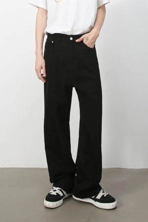 Black wide-leg rigid denim trousers with a casual fit.