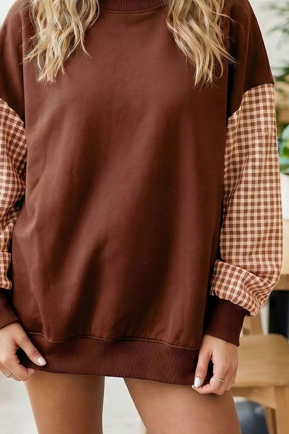 100% polyester Care instructions: Machine wash cold sweatshirt in cream with loose silhouette