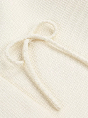 Cream waffle knit top with drawstring detail
