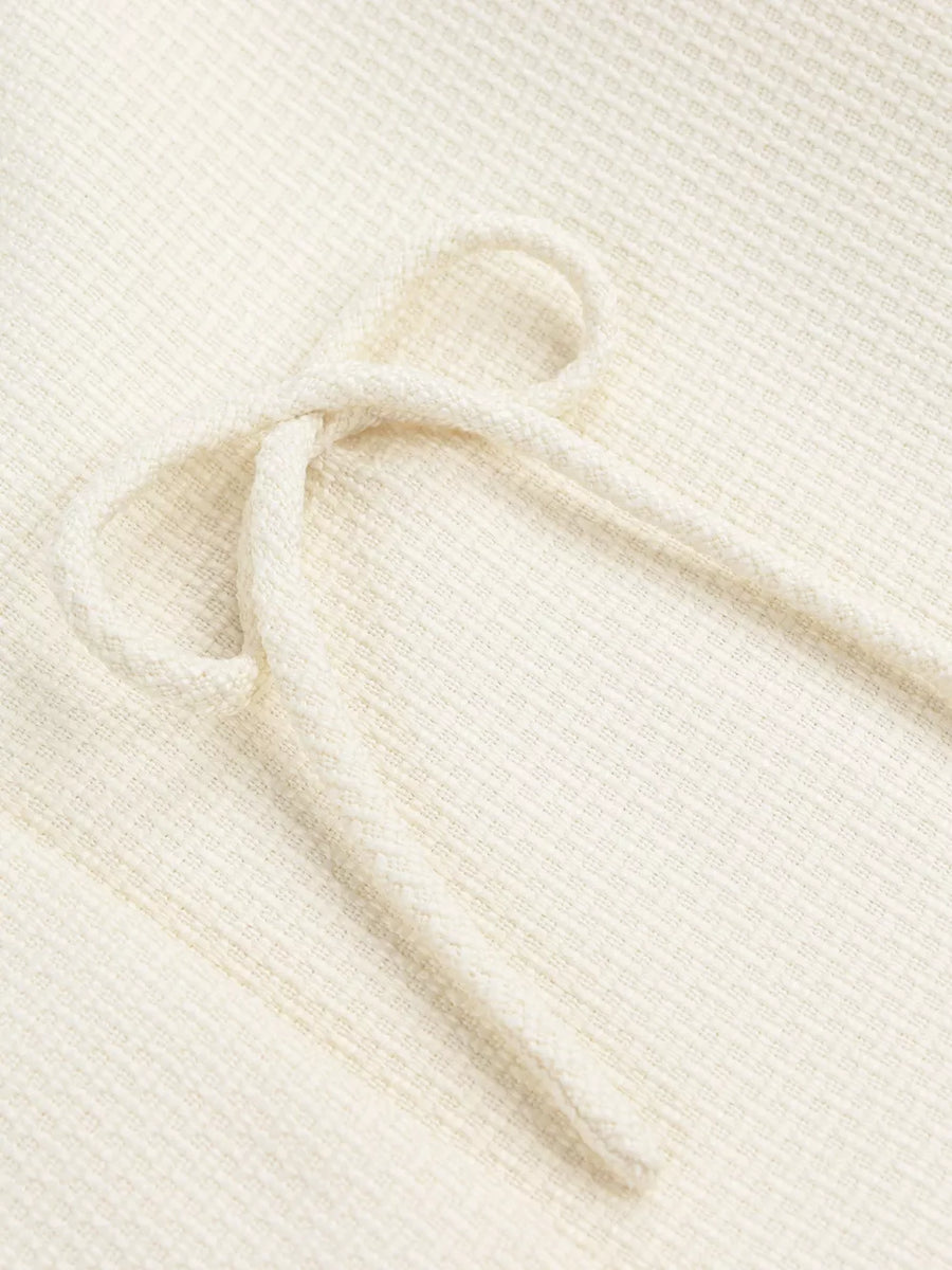 Cream waffle knit top with drawstring detail