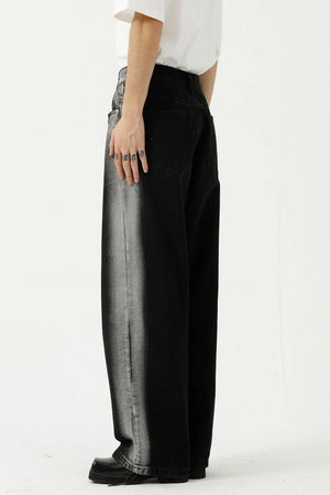 Dark wide leg jeans with faded side panel detail and a relaxed fit.