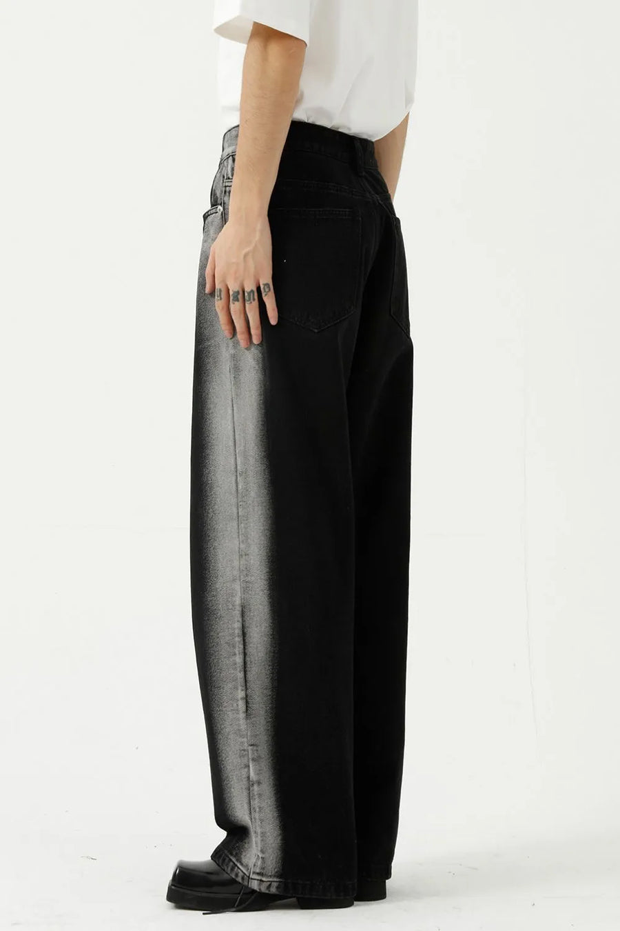 Dark wide leg jeans with faded side panel detail and a relaxed fit.