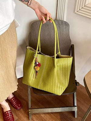 Brown tote featuring woven texture and woven