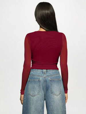 Burgundy mesh long-sleeve t-shirt with rhinestone detail, shown from the back.