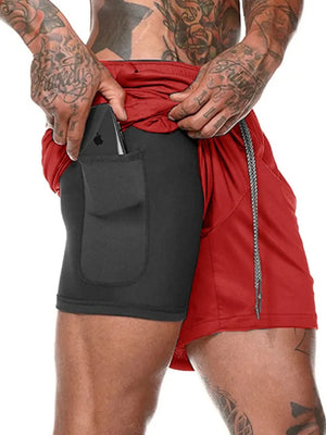Dual-layer performance shorts in red with black compression liner and phone pocket.