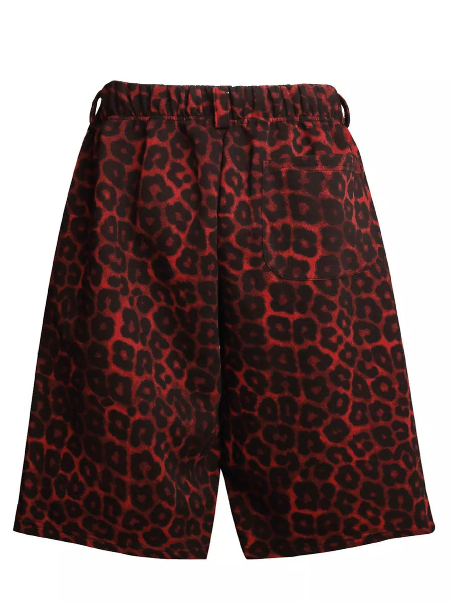 Red leopard print sweatpants with elastic waistband and pockets.