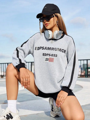 Light gray graphic sweatshirt with varsity stripes on sleeves and black trim.