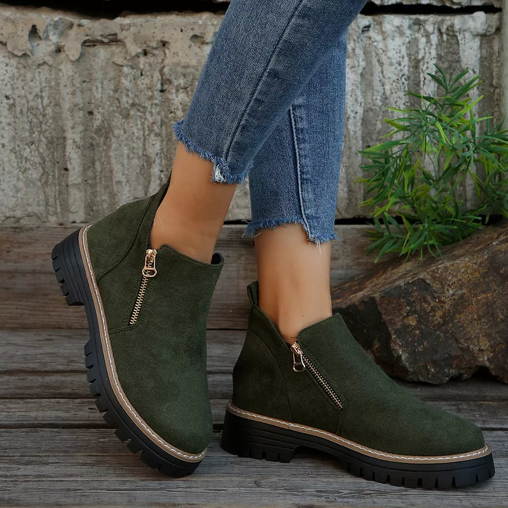 Green suede ankle boots with side zipper and rugged sole
