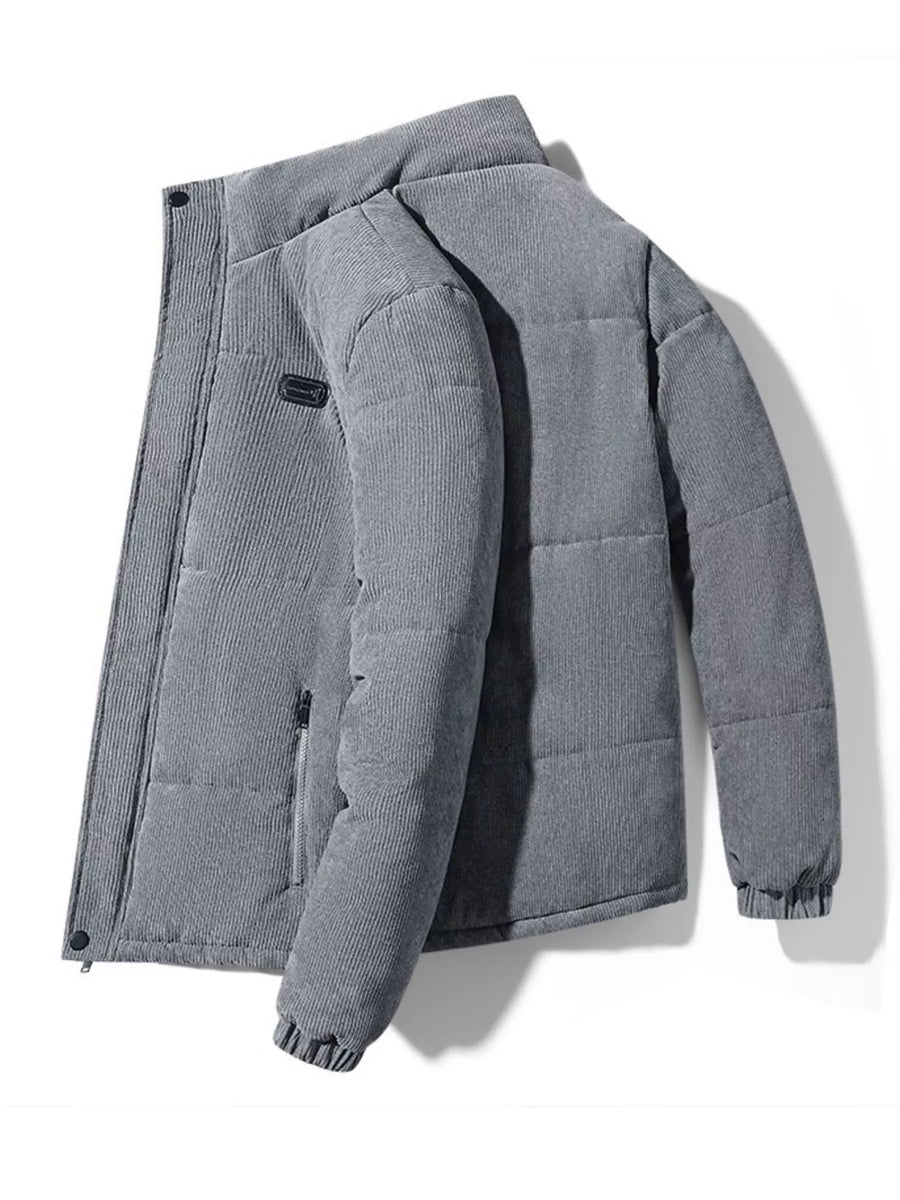 Men's grey corduroy puffer jacket with a zip pocket and elastic cuffs.