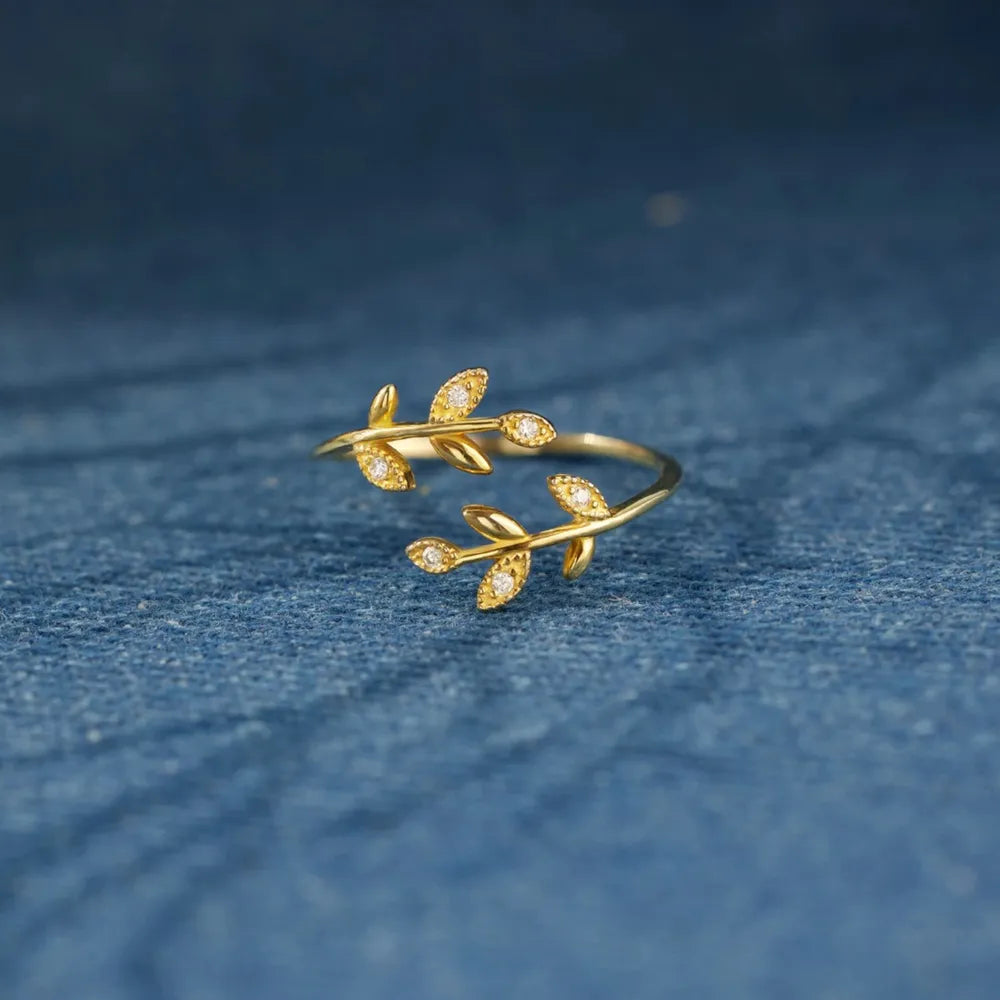 Gold branching zirconia vine ring with delicate leaf design
