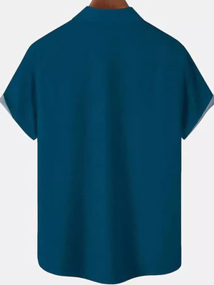 Men's dark blue cotton short sleeve button-down shirt with beige panel detail.