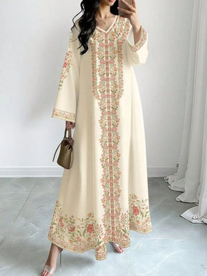 Elegant cream floral maxi dress with V-neck and long sleeves.