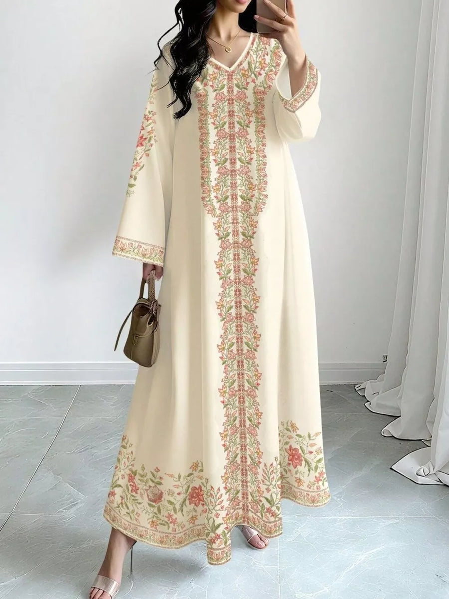 Elegant cream floral maxi dress with V-neck and long sleeves.