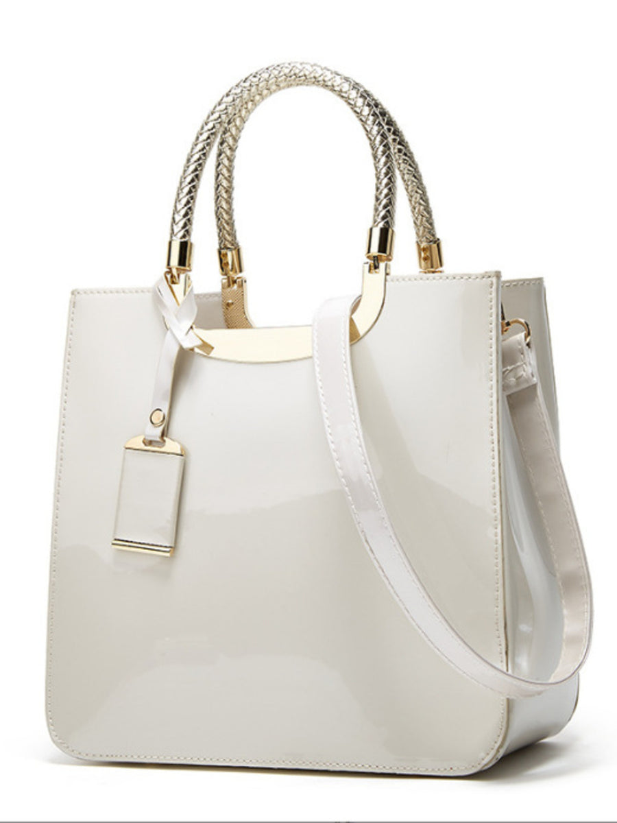 handbag in White with metallic handle and medium