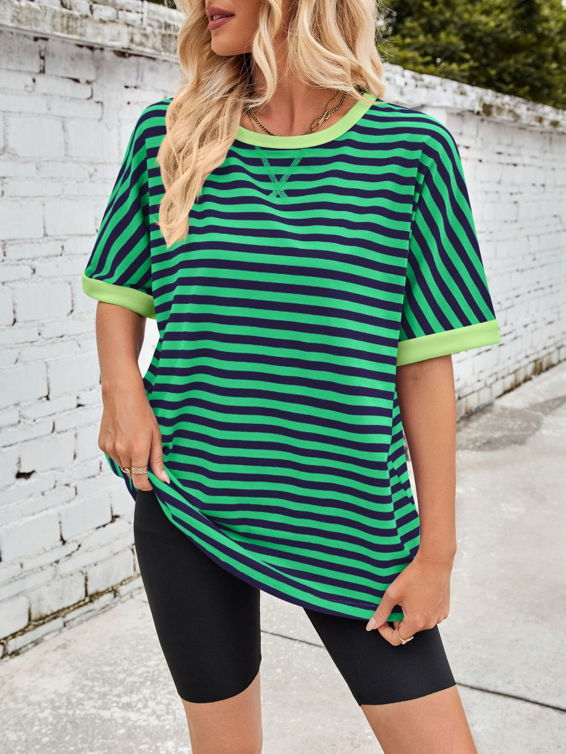 Green and navy striped breton tee with lime trim and crew neck.