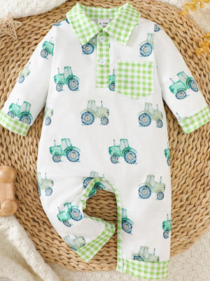 White baby one-piece with green tractor print and green gingham trim collar, pocket, and cuffs.