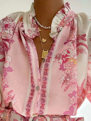 hot pink two-piece set featuring buttoned and floral