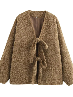 Textured knit tie-front cardigan in dark brown with a cozy, open front and tie closures.